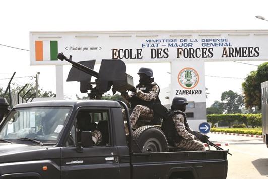 Republican guards deploy outside the military school of Zambakro, near Yamoussoukro.