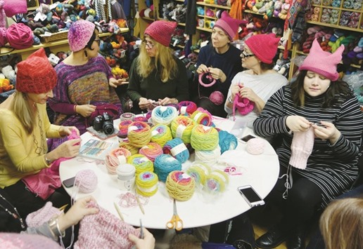 A group of women gather at Knitty City in New York to make their pink Pussyhats in preparation for protests for womenu2019s rights following the election of Donald Trump.