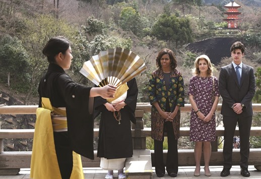 US First Lady Michelle Obama (third right), US ambassador to Japan Caroline Kennedy (second right) and her son Jack Schlossberg (right) watching a student perform a Noh play during a visit to the Kiyomizu-dera temple in Kyoto, in this 2015 photo.