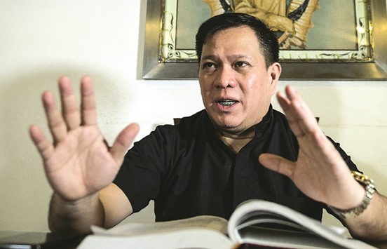 A recent photo shows Catholic Bishops Conference of the Philippines (CBCP) spokesman Father Jerome Secillano gesturing during an interview at a church in Blumentrit in Manila.