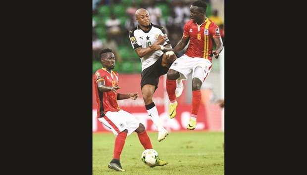 Ghanau2019s Andre Ayew (centre) vies for the ball with Ugandau2019s Tony Mawejje (right) and Denis Iguma during the Africa Cup of Nations Group D match in Port-Gentil, Gabon on Tuesday. (AFP)