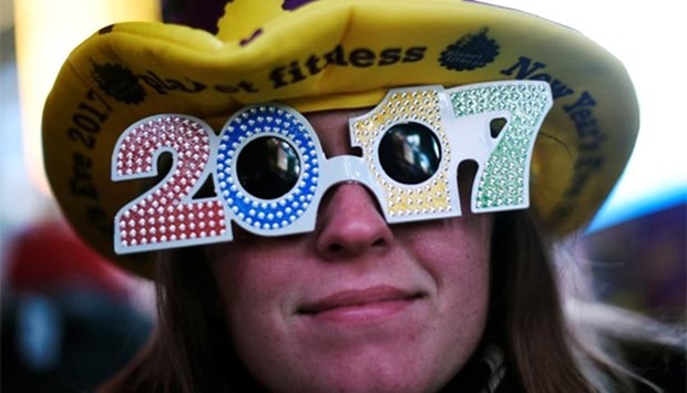 A reveller wears '2017' glasses during New Year's Eve festivities in Times Square, New York.