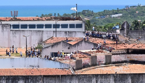 Inmates are seen during an uprising at Alcacuz prison in Natal