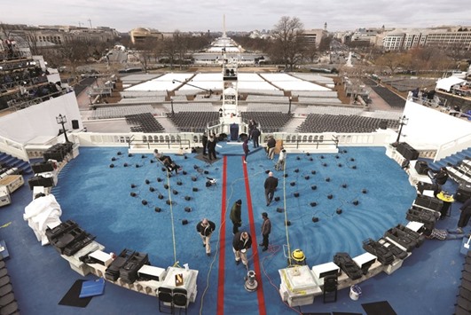 Workers prepare the inauguration of President-elect Trump at the US Capitol in Washington, DC.