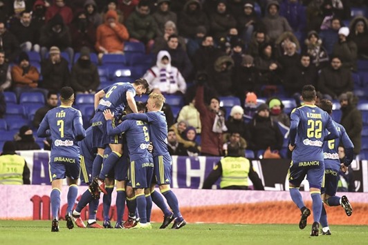 Celta Vigo players celebrate after scoring their second goal during the Spanish Copa del Rey quarter-final first leg against Real Madrid in Madrid on Wednesday. (AFP)