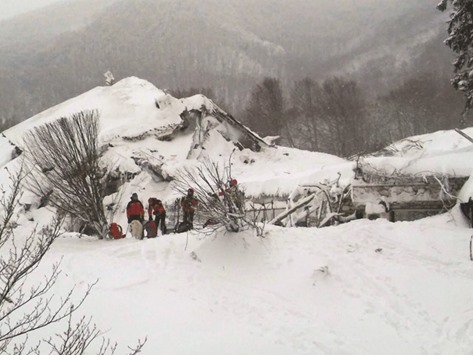 A handout picture released by the Corpo Nazionale Soccorso Alpino e Speleologico (CNSAS) shows rescuers taking part in the operations at the ruins of the Hotel Rigopiano.