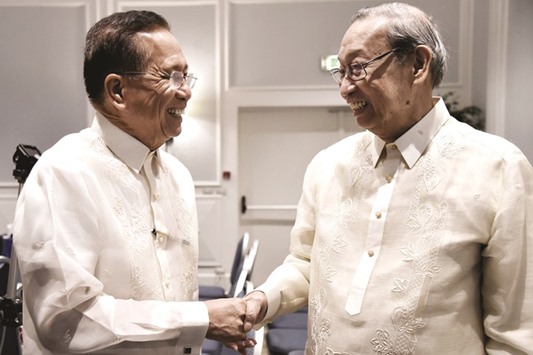 Chief of the National Democratic Front of Philippines (NDFP) Jose Maria Sison (right) shakes hand with  Philippines Presidential Adviser on the Peace Process Jesus G Dureza during the opening ceremony of the formal peace talks between the Philippine government and the (NDFP) in Rome yesterday.