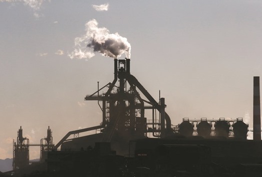 Chimneys of a steel factory is seen at an industrial area in Kawasaki. Japan is threatening to take India to the WTO over restrictions that nearly halved its steel exports to the South Asian nation over the past year, a step that could trigger more trade spats as global tensions over steel and other commodities run high.
