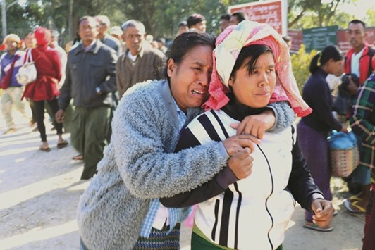 Relatives of the farmers react before they were released from jail yesterday in Taunggyi, Myanmar.
