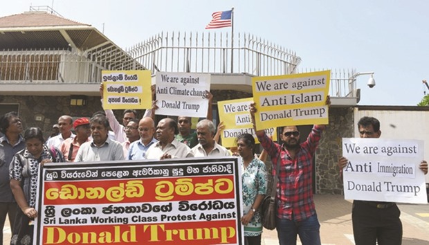 Rights activists demonstrate outside the US embassy in Colombo yesterday, ahead of the inauguration of Donald Trump as the 45th President of the United States.