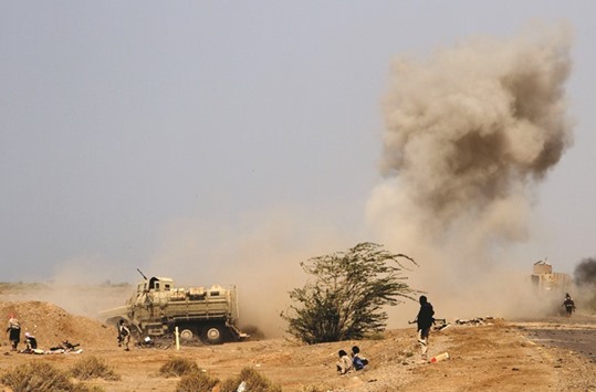 A landmine explodes as Yemeni loyalist forces patrol an area near the Red Sea port town of Mocha yesterday.