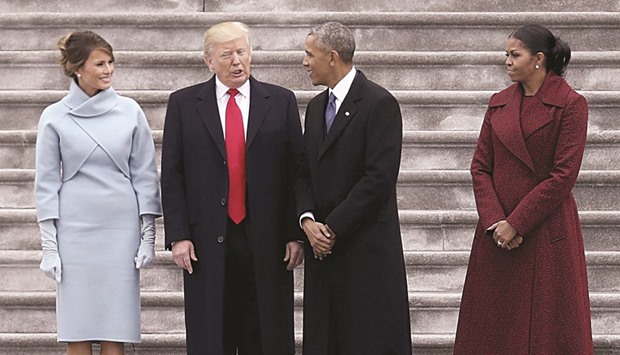 President Trump and former president Obama exchange words at the US Capitol with First Lady Melania and Michelle Obama.