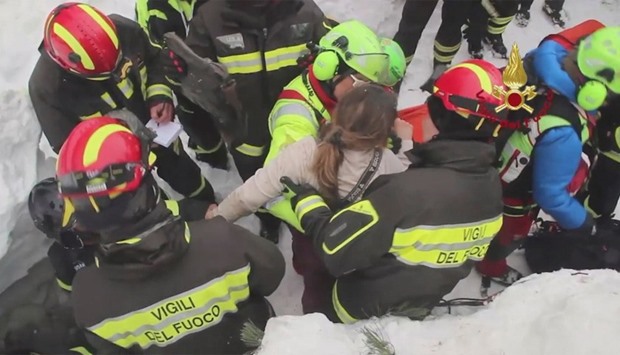 Firefighters rescue a survivor from Hotel Rigopiano in Farindola, central Italy, hit by an avalanche