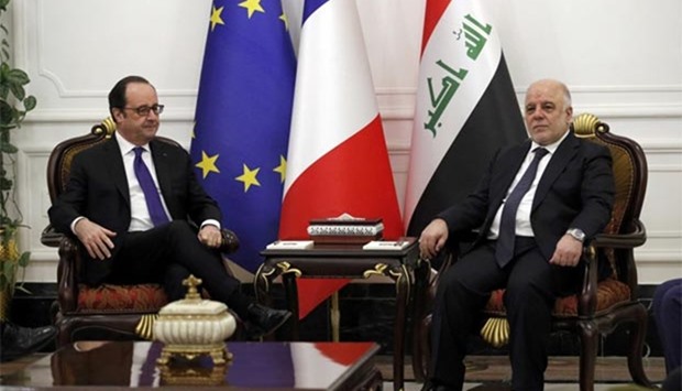 Iraq's Prime Minister Haider al-Abadi and French President Francois Hollande meet in Baghdad on Monday.