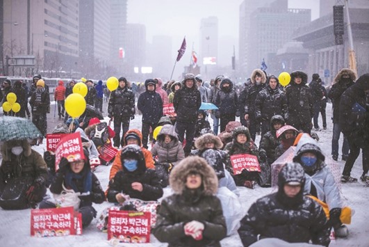 Protesters gather on Gwanghwamun square during an anti-government protest in central Seoul yesterday.