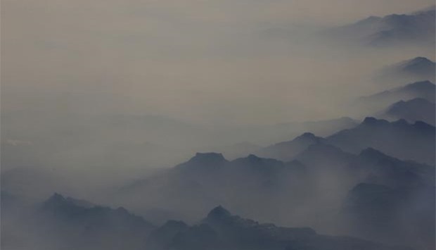 Heavy smog is seen in the mountains over north China's Hebei province on Monday.