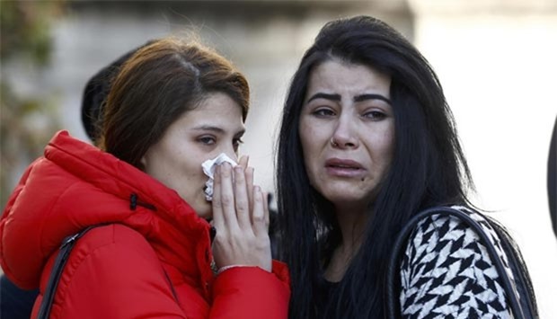 Relatives react at the funeral of Busra Kose, a victim of an attack at Reina nightclub, in Istanbul on Monday.