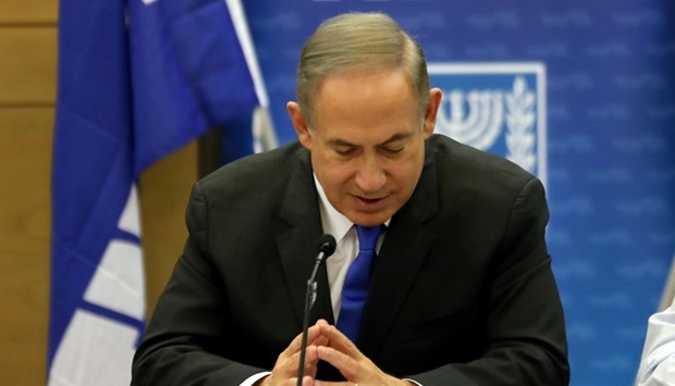 Israeli Prime Minister Benjamin Netanyahu gestures as he speaks during a Likud faction meeting at the Knesset (Israel's Parliament) in Jerusalem.