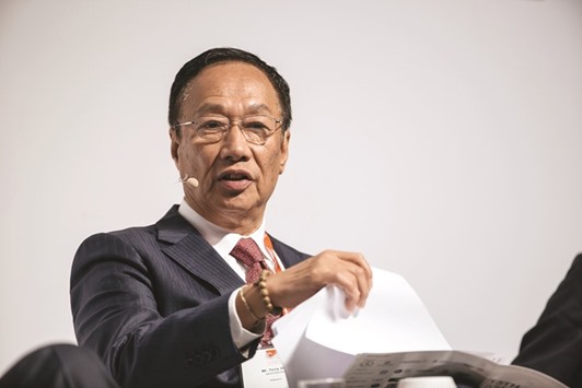Terry Gou, chairman of Foxconn Technology Group, speaks at the Asia-Pacific Conference of German Business in Hong Kong on November 5, 2016. u201cI have discussed with my major clients about going to (the US) and they are also willing to invest, including Apple,u201d Gou told reporters in Taipei yesterday.