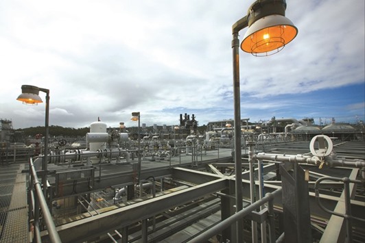 Lamps stand at the Queensland Curtis Liquefied Natural Gas (QCLNG) project site, operated by QGC, a unit of Royal Dutch Shell, in Gladstone, Australia on June 15, 2016. Global LNG production is expected to generate a record surplus of 46mn metric tonnes a year by 2019, or about 13% more than the market needs, according to Sanford C Bernstein & Co.