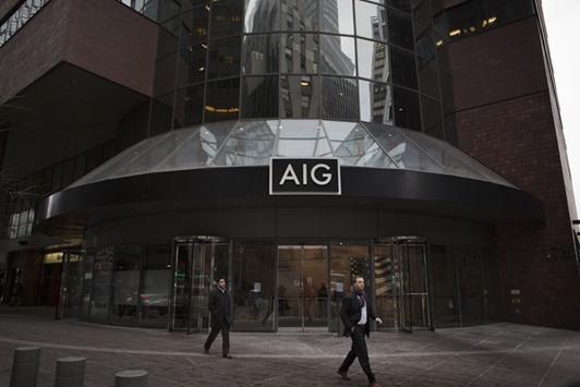 Pedestrians walk past the American International Group (AIG) headquarters office in New York. AIG has struggled with worse-than-expected losses on workersu2019 compensation policies, commercial-vehicle coverage and insurance that protects companies or their executives against lawsuits.