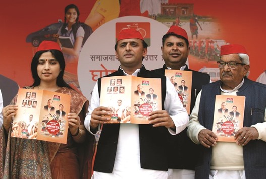 Newly appointed Samajwadi Party president and chief minister of Uttar Pradesh, Akhilesh Yadav, poses for the media at the release of the partyu2019s manifesto for the upcoming assembly polls, at the partyu2019s headquarters in Lucknow, yesterday.