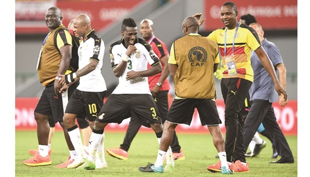 Ghanau2019s forward Asamoah Gyan (left) celebrates with team staff after their win over Mali in the Africa Cup of Nations match on Saturday. (AFP)