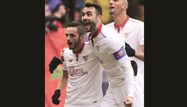 Sevillau2019s Vicente Iborra (right) and Pablo Sarabia celebrate after their teamu2019s third goal during the Spanish La Liga match against Osasuna in Pamplona, Spain. (AFP)