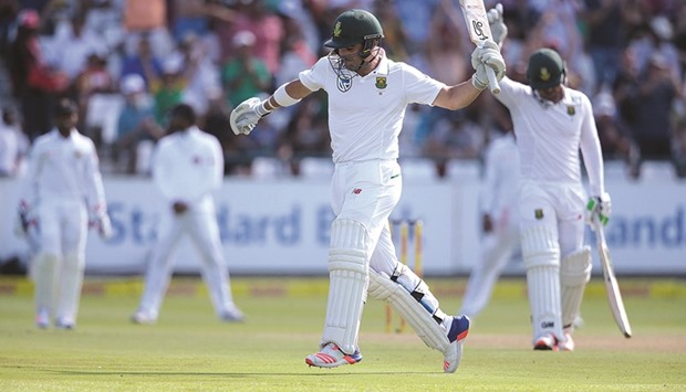 South African batsman Dean Elgar (C) celebrates after scoring a century against Sri Lanka at Newlands Cricket Stadium in Cape Town yesterday.