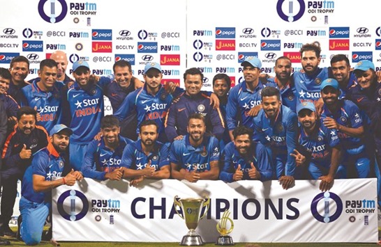 Indiau2019s players pose with the trophy after winning the ODI series against England. (Reuters)