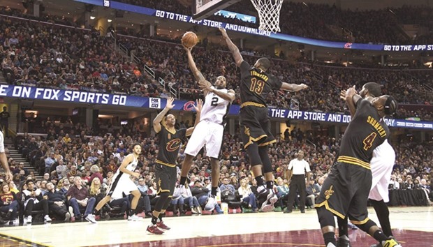Kawhi Leonard #2 of the San Antonio Spurs shoots over Tristan Thompson #13 of the Cleveland Cavaliers during the second half at Quicken Loans Arena.