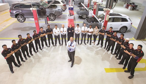 Workshop staff at the Audi service centre in the Industrial Area.