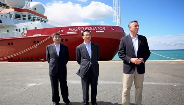 Zhi Guanglu, director of China's Maritime Search and Rescue Centre, Malaysian Transport Minister Liow Tiong Lai and Australian Federal Infrastructure and Transport Minister Darren Chester stand next to the vessel Fugro Equator, which was involved in the search for missing Malaysian Airlines Flight MH370, during a media conference in Perth on Monday.