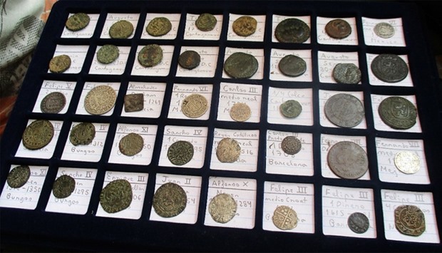 Ancient coins on display, recovered by the Spanish Guardia Civil during a joint operation