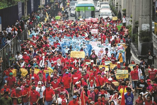 Members of the National Democratic Front of the Philippines (NDFP) hold a demonstration calling for peace negotiations and social economic reforms in Manila yesterday.