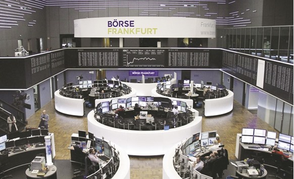 Traders at the Frankfurt Stock Exchange. The DAX 30 index dropped 0.7% to 11,545.75 points yesterday.