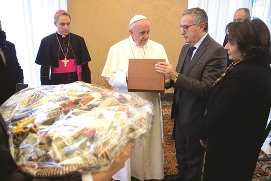 This handout picture released by the Vatican press office shows Pope Francis listening to Franco Roberti, the head of Italyu2019s anti-mafia and anti-terrorism services.