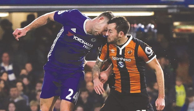 Hull City midfielder Ryan Mason (right) was carried off and received oxygen after a clash of heads with Chelseau2019s Gary Cahill during the English Premier League match at Stamford Bridge in London on Sunday. (AFP)