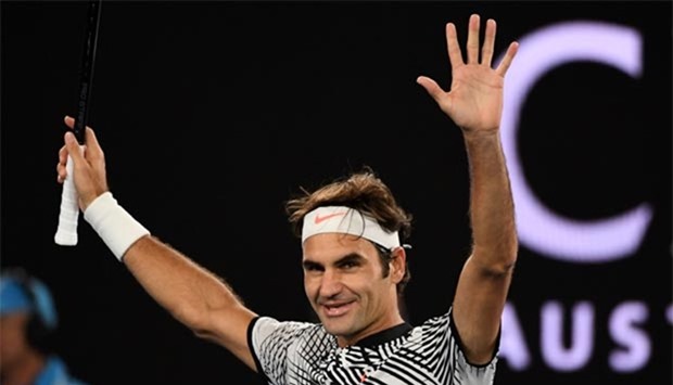 Roger Federer celebrates his victory against Germany's Mischa Zverev in Melbourne on Tuesday.