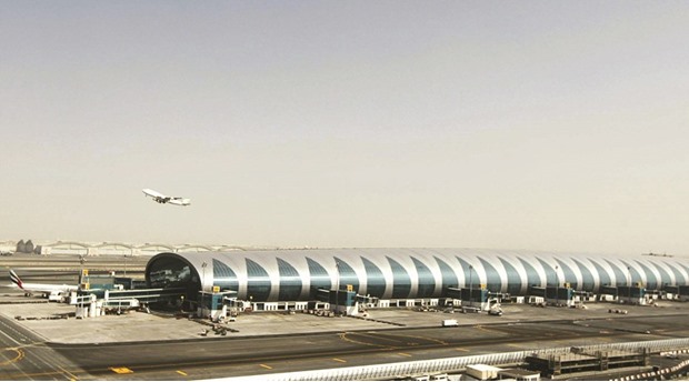 A plane takes off near the new terminal dedicated for A380 aircraft at the concourse in Dubai International Airport (file). The Gulf hub expects to lure 89mn travellers, 6.4% fewer than in 2016, it said in a statement yesterday.