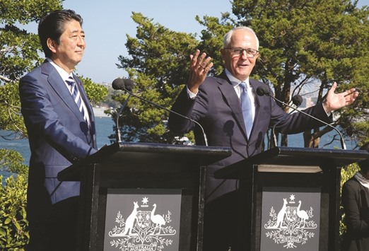Japanese Prime Minister Shinzo Abe listens as Australian Prime Minister Malcolm Turnbull talks to members of the media after their bilateral meeting at Kirribilli House in Sydney. Turnbull said he had held discussions with Abe, New Zealand Prime Minister Bill English and Singapore Prime Minister Lee Hsien Loong overnight about the possibility of proceeding the Trans-Pacific Partnership without the US.