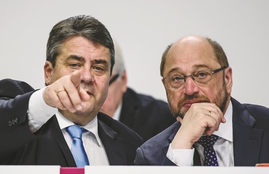 This picture taken on December 12, 2015 shows Gabriel with Schulz at the annual SPD federal congress in Berlin.