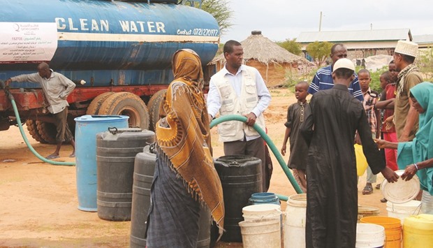 Qatar Charity providing drinking water to poor families in Kenya.