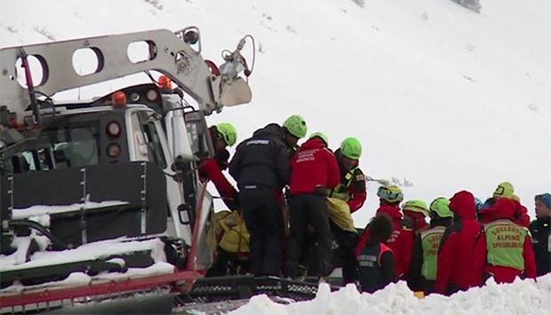 Rescuers working to evacuate the bodies of six people killed in an helicopter crash in the mountains near the ski resort of Campo Felice, central Italy on Tuesday.