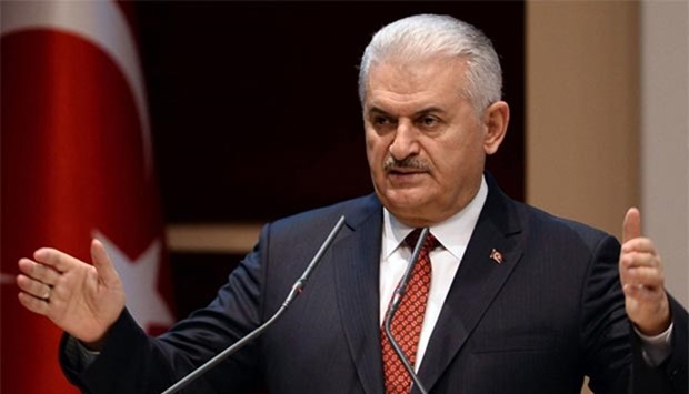 Turkish Prime Minister Binali Yildirim gestures as he delivers a speech during the 115th enlarged meeting of provincial chairmen of Justice and Development Party (AKP) at the AK Party's headquarters in Ankara on Wednesday.