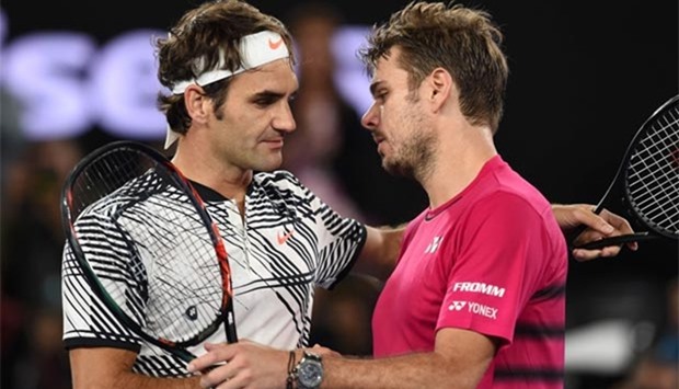 Roger Federer shakes hands with Stanislas Wawrinka after winning the semi-final of the Australian Open in Melbourne on Thursday.