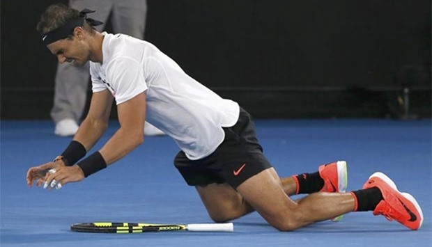 Spain's Rafael Nadal falls onto the court as he celebrates his win against Bulgaria's Grigor Dimitrov.