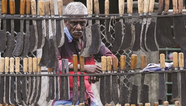 A street vendor displays knives for sale in Colombo yesterday.