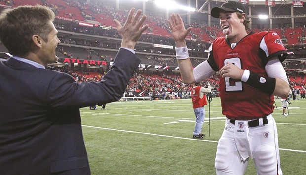In this November 28, 2010, picture, Atlanta quarterback Matt Ryan and general manager Thomas Dimitroff celebrate the Falconsu2019 20-17 victory over the Green Bay Packers at the Georgia Dome in Atlanta. Dimitroffu2019s key decision with the Falcons may have come at the start when he selected quarterback Ryan third overall in 2008. (TNS)