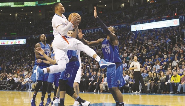 Oklahoma City Thunder guard Russell Westbrook (foreground) drives to the basket during the NBA game against Dallas Mavericks in Oklahoma City on Thursday. (USA TODAY Sports)